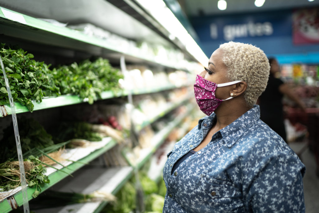Woman at grocery store with mask on