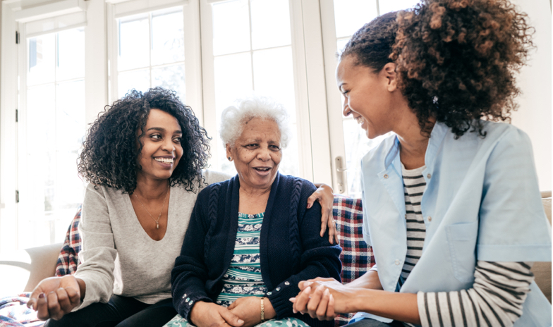 Older woman with family smiling together