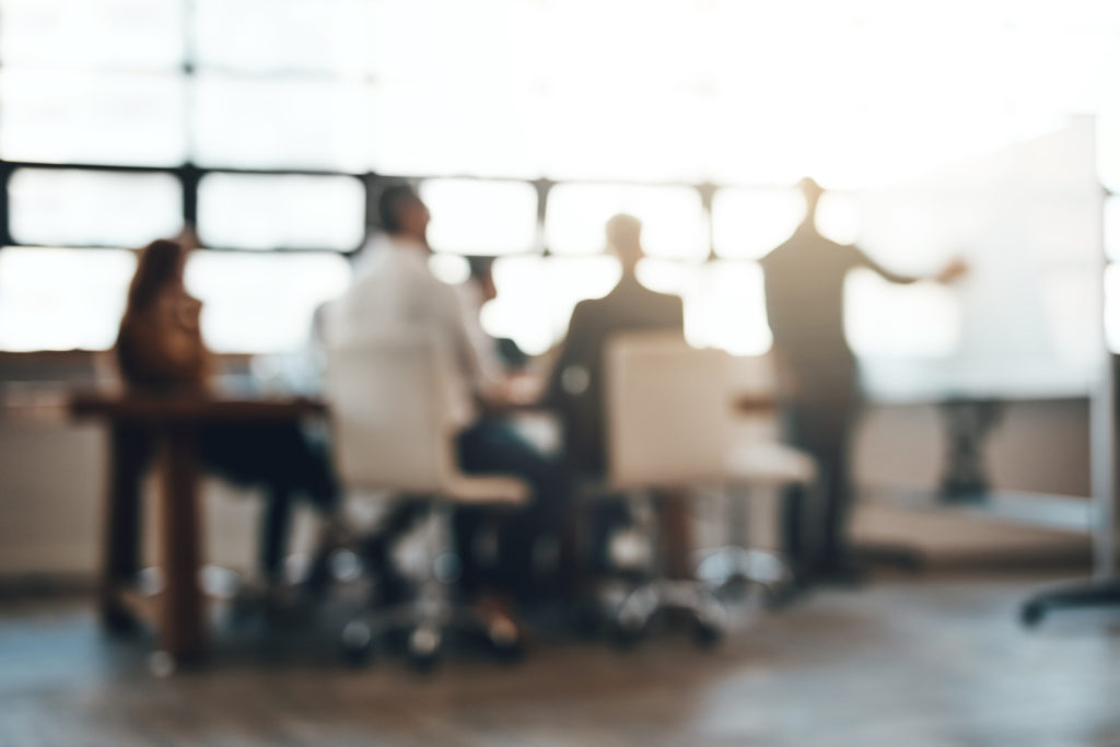 Business meeting at an office with a whiteboard