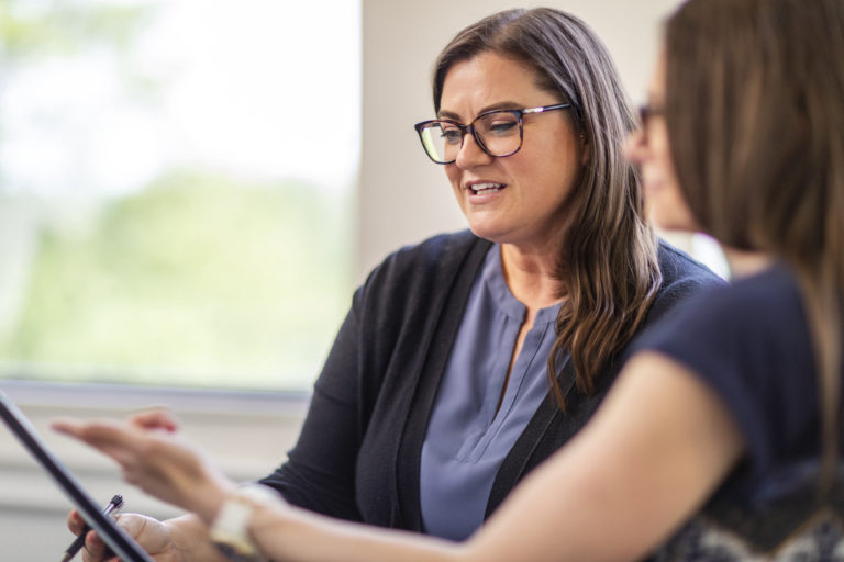 Two women looking at iPad