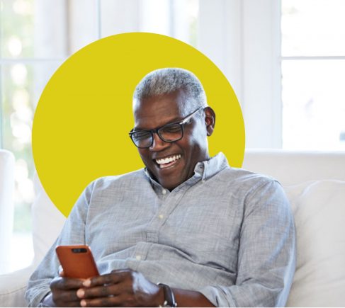 Man smiling at smartphone